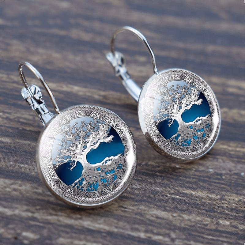 Sylvara™ | Silver Tree of Life Hoop Earrings" can be rewritten as:
"Sylvara™ | Silver Hoop Earrings with Tree of Life Design